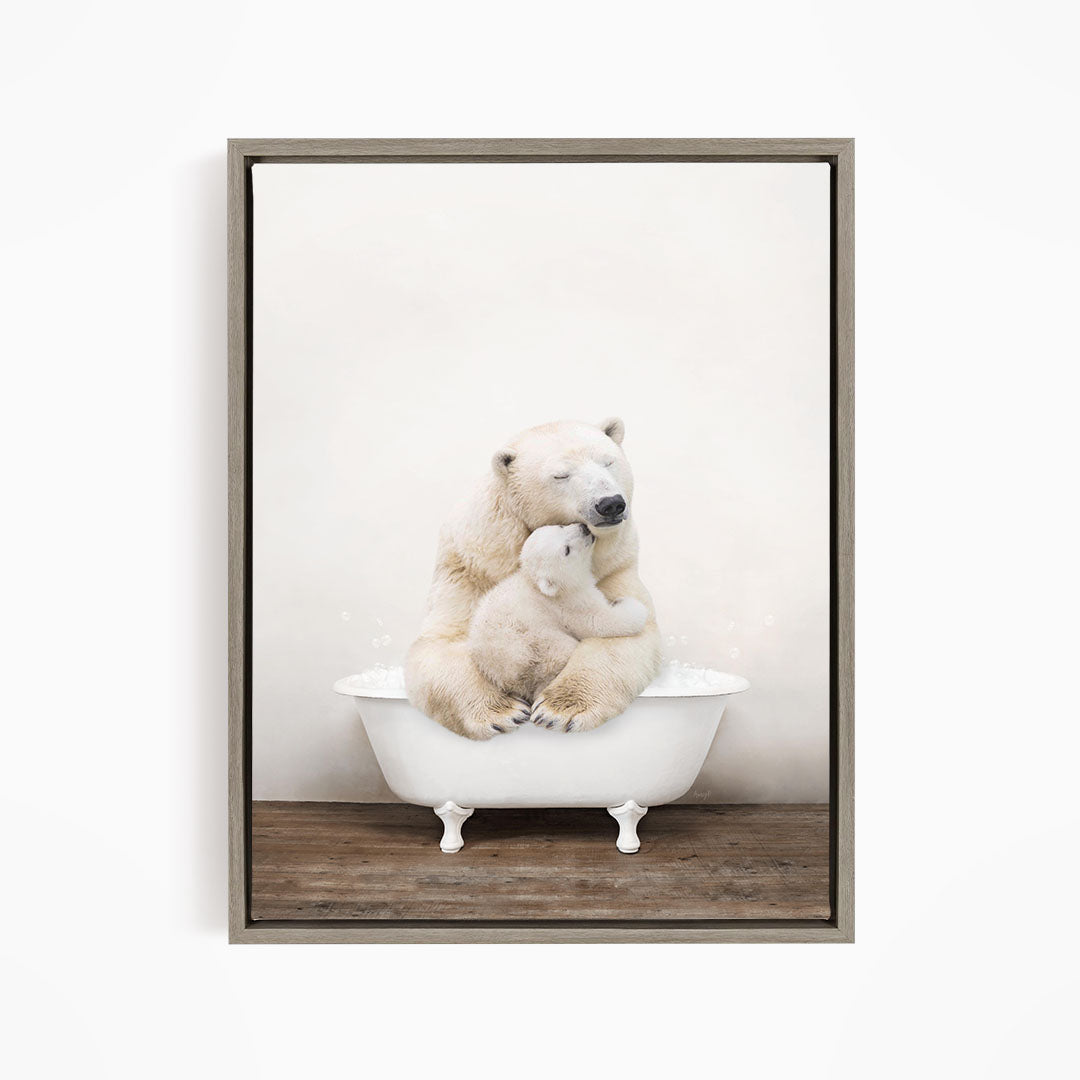 A mother polar bear and her cub sitting together in a white bathtub, with the mother appearing to be comforting her cub.