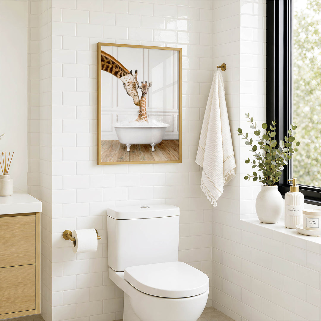 A bathroom with a white toilet, a framed image of a giraffe in a bathtub, and a towel rack with a towel.