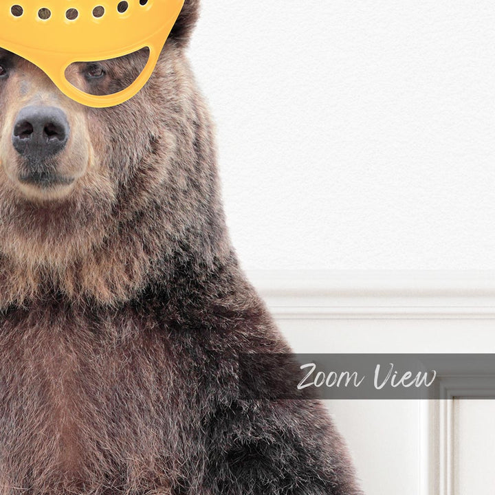 a bear with a yellow mask on its head