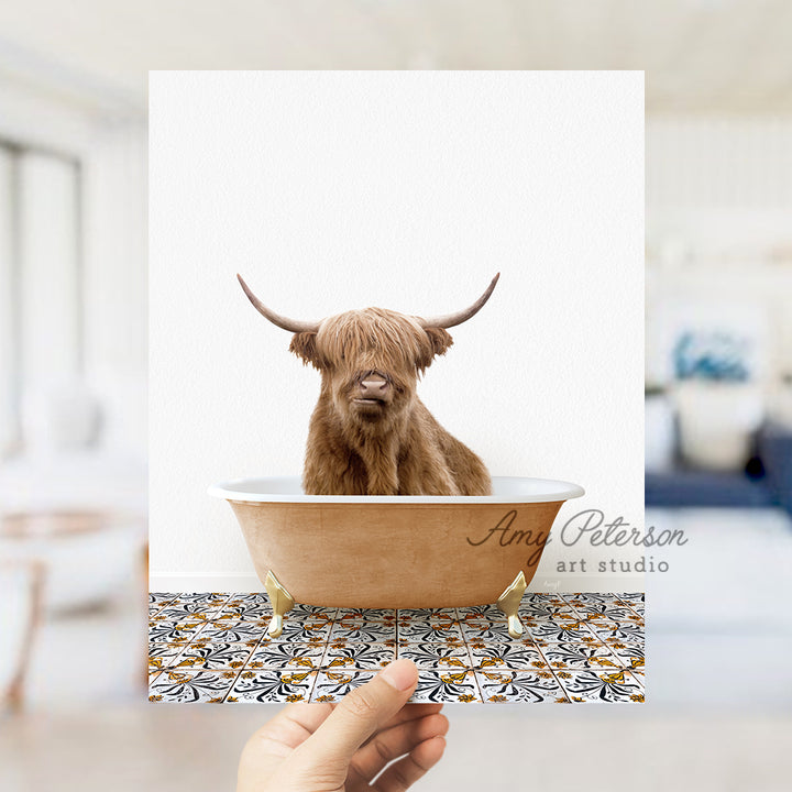 a hand holding a card with a picture of a bull in a bathtub