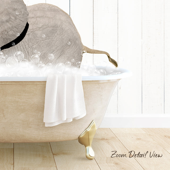 A bathtub filled with bubbles, with a towel and a gold faucet visible.