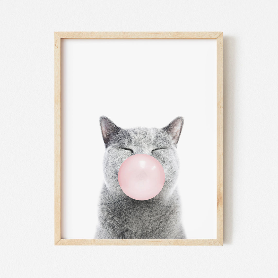 a picture of a cat with a bubble in its mouth