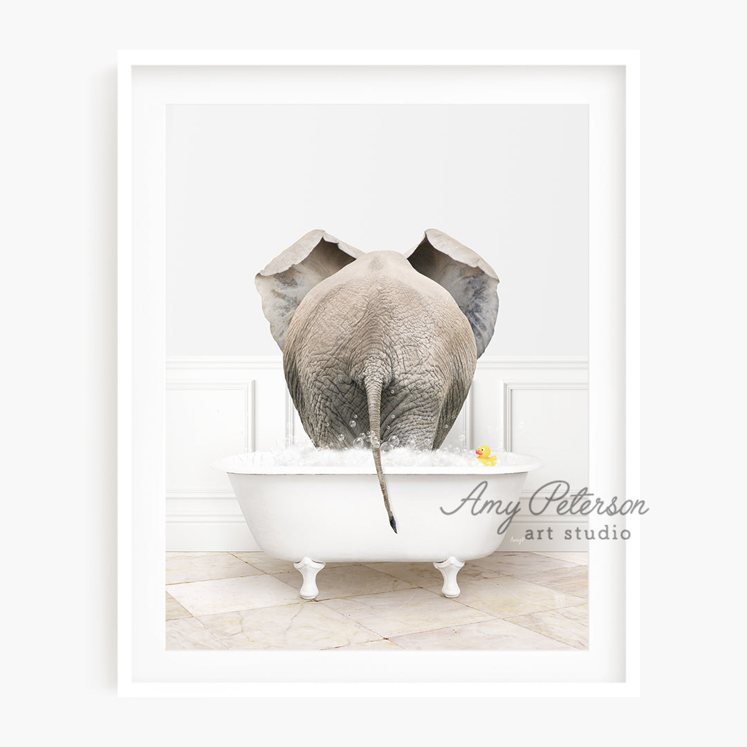 a picture of an elephant taking a bath