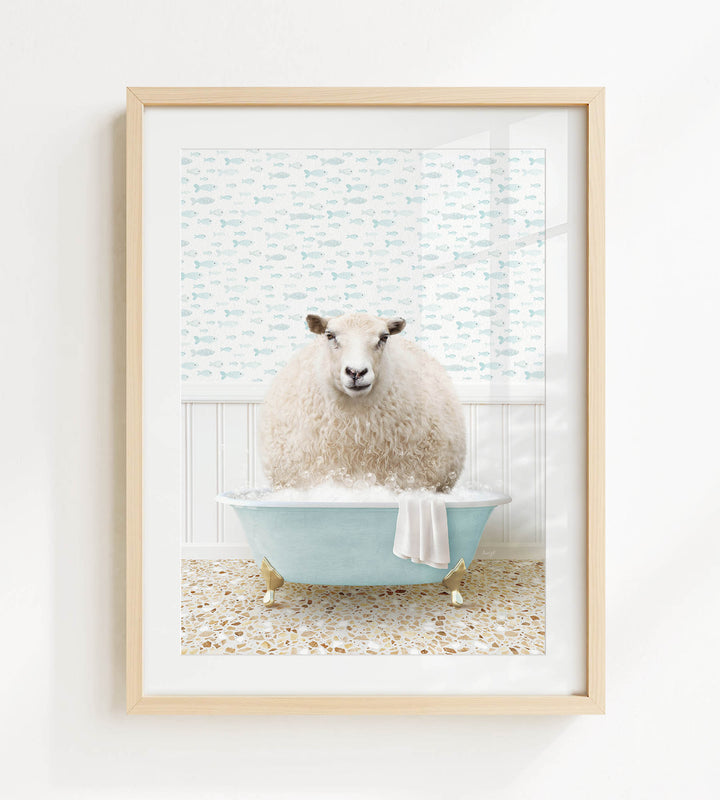 A fluffy white sheep sits in a blue bathtub filled with bubbles, surrounded by a patterned wall and a tiled floor.