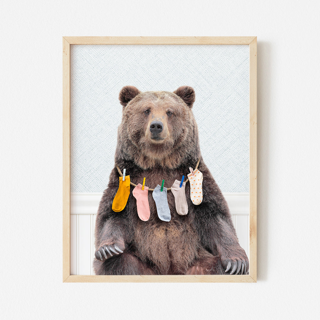 a picture of a bear with socks hanging from it's legs