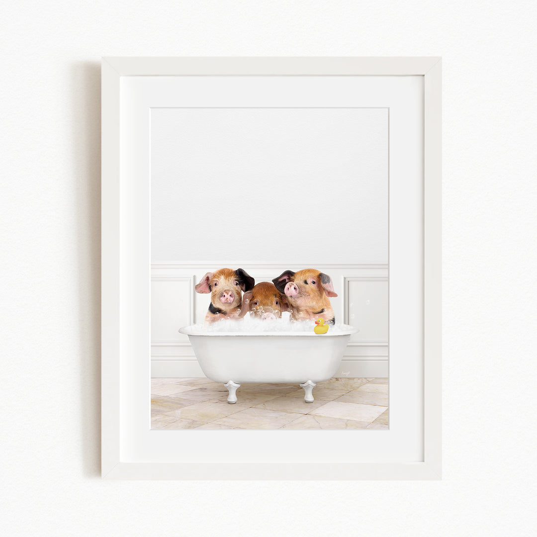Three adorable pigs sitting in a white bathtub, enjoying a bath together.