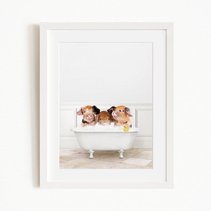 Three adorable pigs sitting in a white bathtub, enjoying a bath together.