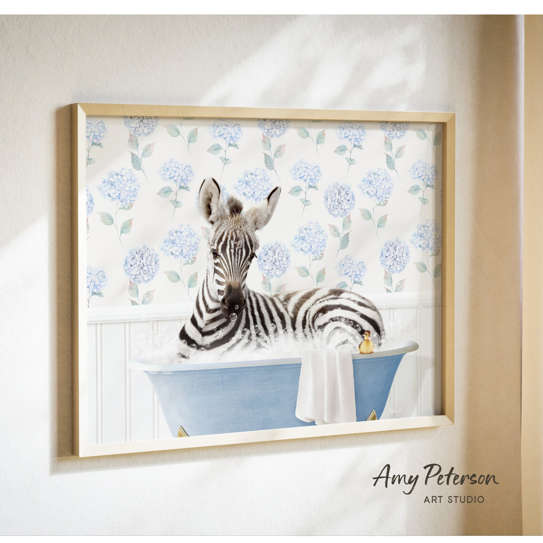 A zebra is sitting in a blue bathtub, surrounded by a floral pattern on the wall behind it.