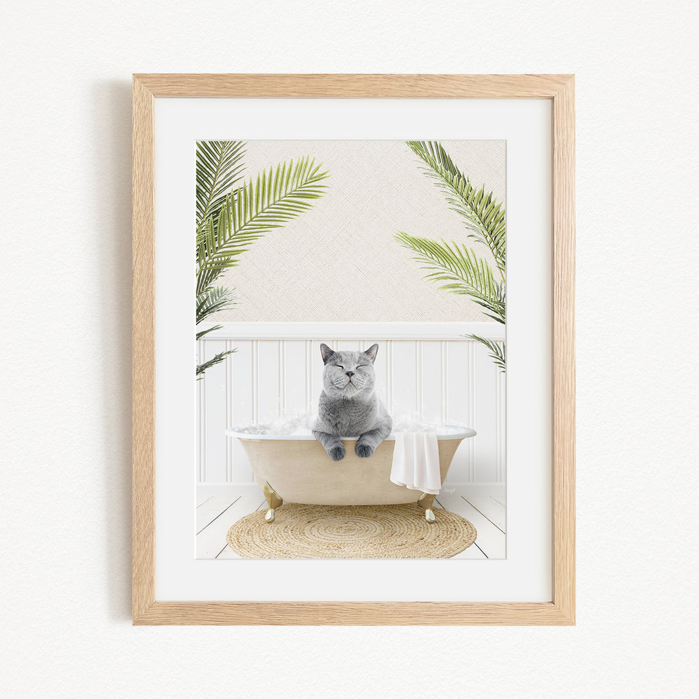 A gray cat sitting in a white bathtub, surrounded by green plants, in a serene and relaxing setting.