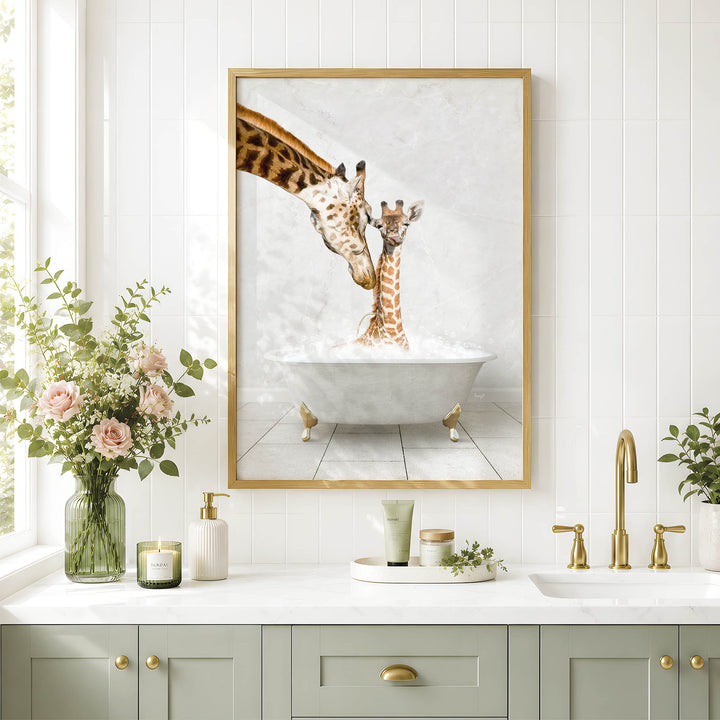A framed image of two giraffes standing in a bathtub, with one giraffe partially submerged in the water, is displayed on the wall above a bathroom counter with various toiletries and a vase of flowers.