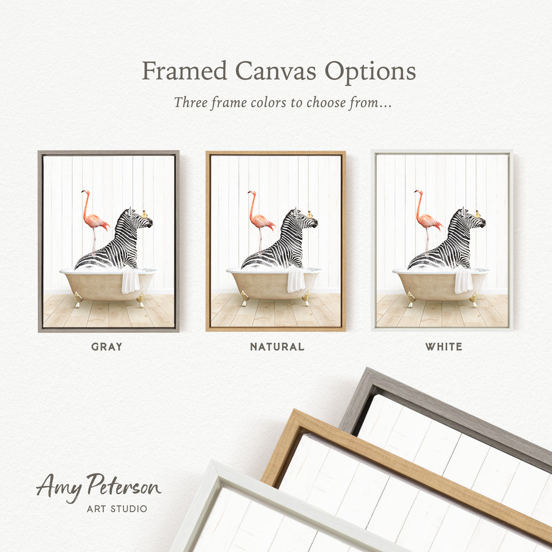 The image is a framed canvas option showcasing three different frame colors: gray, natural, and white. The canvas features a zebra and a flamingo in a bathtub, with the zebra in a gray frame and the flamingo in a natural frame, and the flamingo in a white frame.