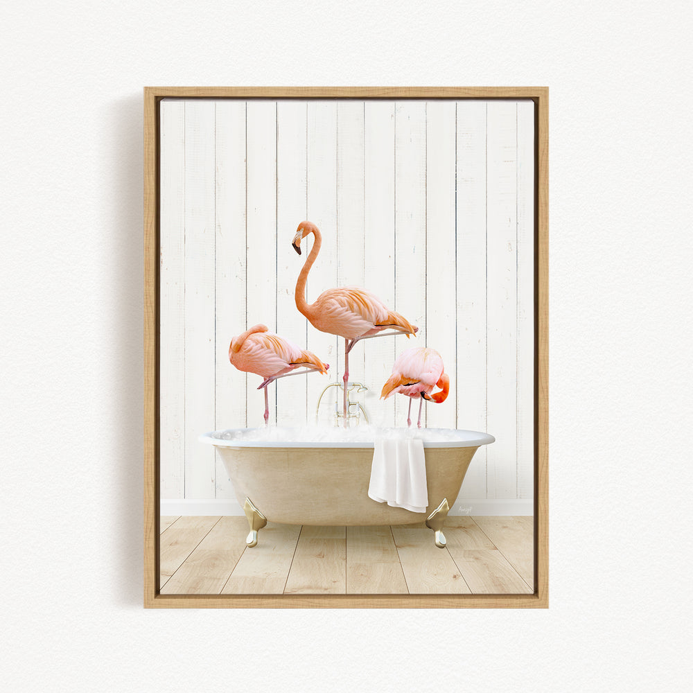 A framed image depicting three flamingos standing in a bathtub filled with water, creating a whimsical and playful scene.