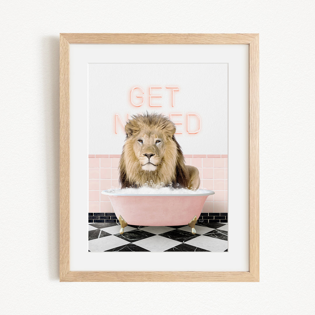 A framed image of a lion sitting in a pink bathtub with the text "GET NICKED" written on the wall behind it.