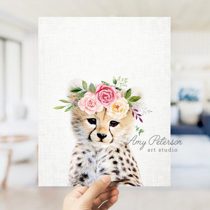 a hand holding up a card with a picture of a cheetah wearing a