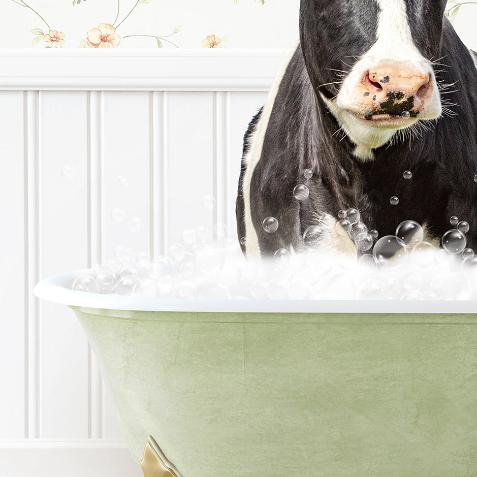 a black and white cow standing in a bathtub filled with bubbles