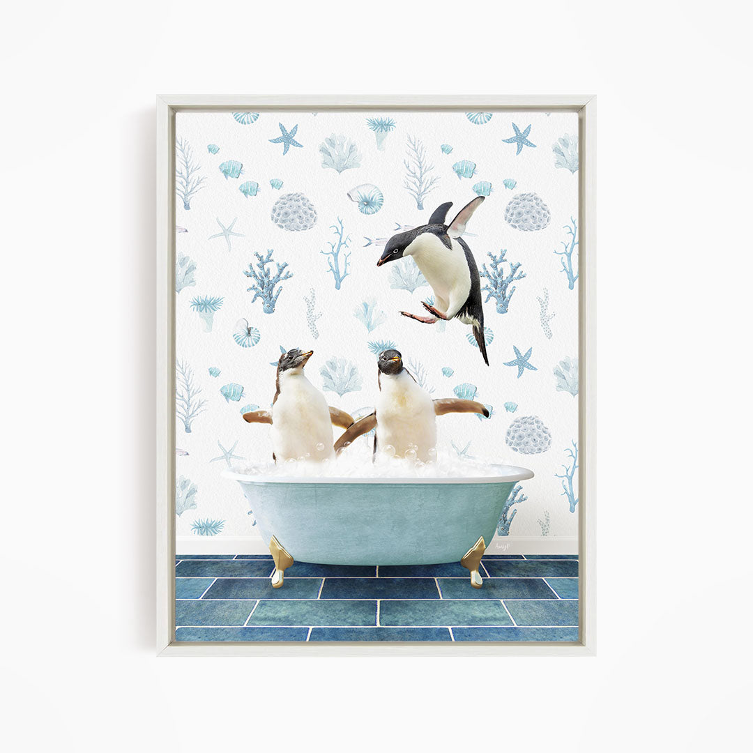 A framed image depicting two penguins sitting in a bathtub, with one penguin jumping out of the tub.