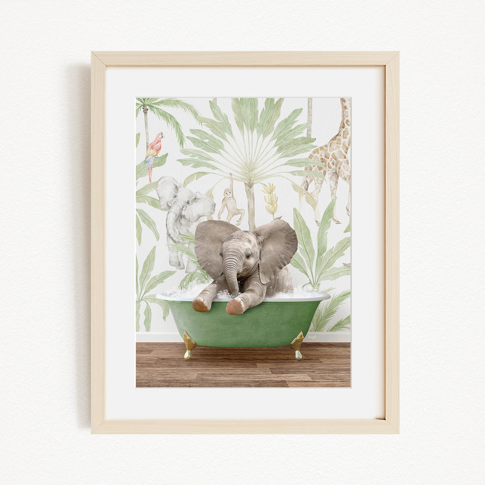 A framed print depicting a baby elephant sitting in a green bathtub, surrounded by a tropical jungle wallpaper.