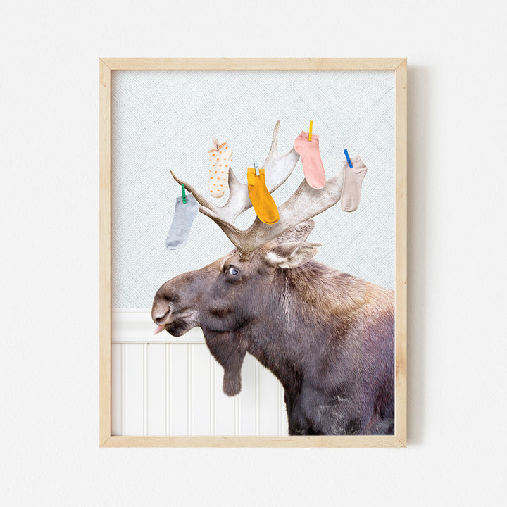 a moose with a bunch of socks on it's antlers