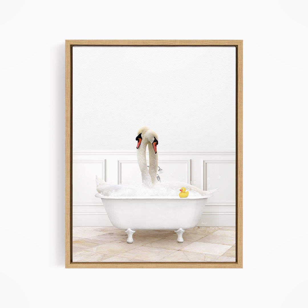 A white swan is sitting in a white bathtub, surrounded by bubbles, with a rubber duck floating nearby.