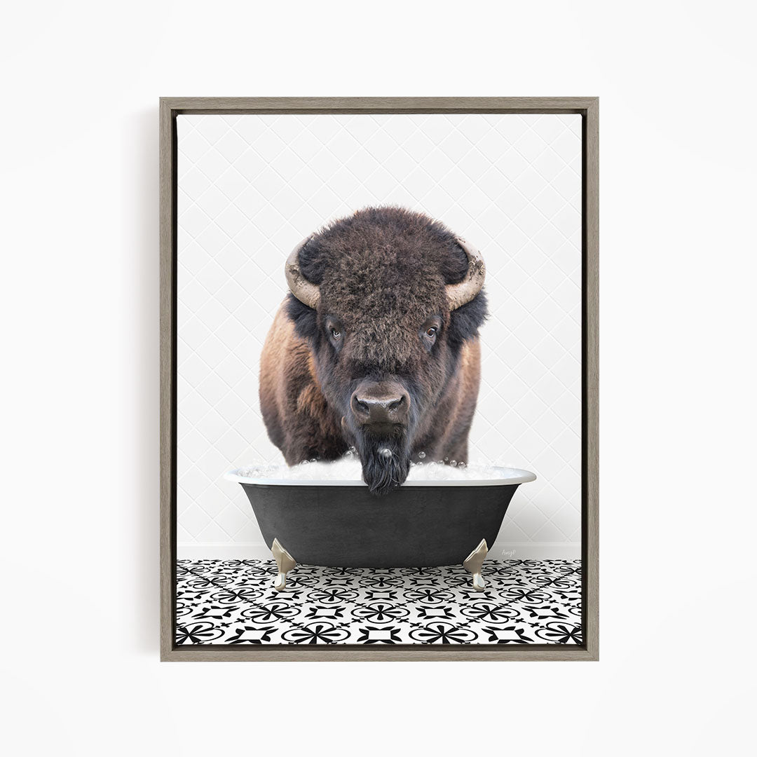 A buffalo with large horns is standing in a bathtub filled with water, creating a playful and whimsical scene.