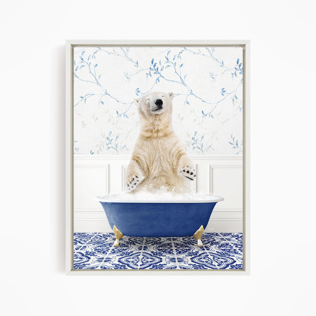 A polar bear sitting in a blue bathtub filled with bubbles, surrounded by a blue and white patterned floor.