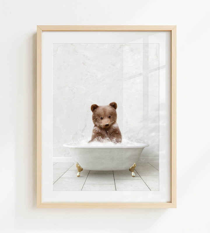 A brown bear sitting in a white bathtub filled with bubbles, creating a whimsical and playful scene.