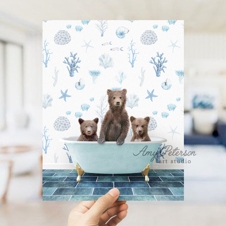 a person holding up a card with three bears in a bathtub