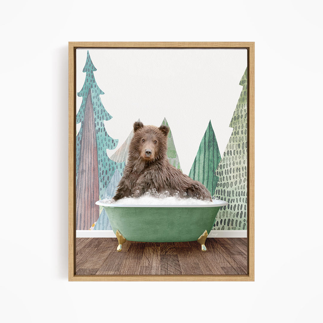 A brown bear is sitting in a green bathtub, surrounded by a forest scene with trees and a snowy landscape.
