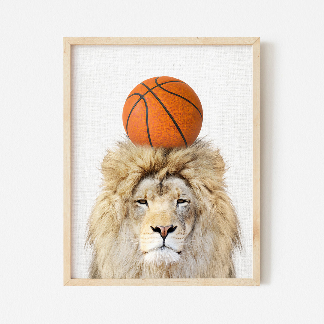 a lion with a basketball on its head