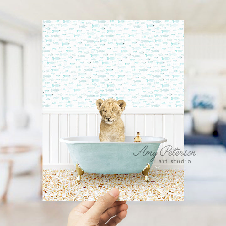 a hand holding up a card with a picture of a baby bear in a bath