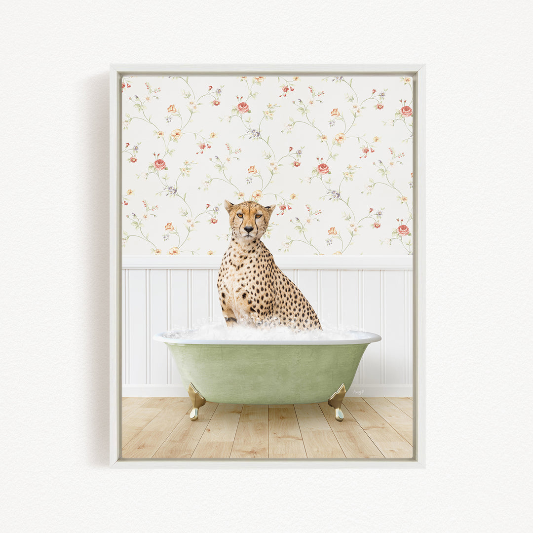 A cheetah sitting in a green bathtub filled with water, with a floral wallpaper in the background.