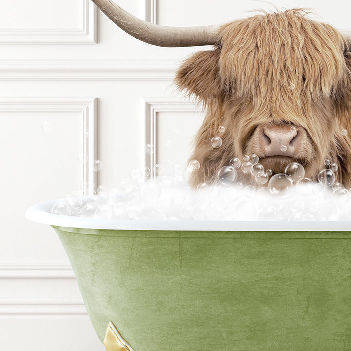 a bull with long horns sitting in a bathtub filled with bubbles