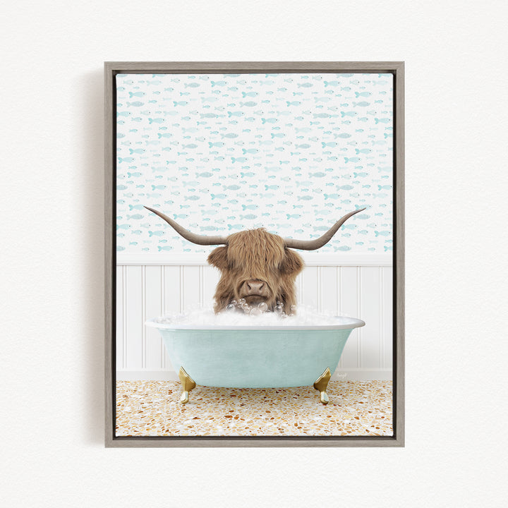A brown cow with long horns is sitting in a light blue bathtub filled with water, surrounded by a pattern of small fish.
