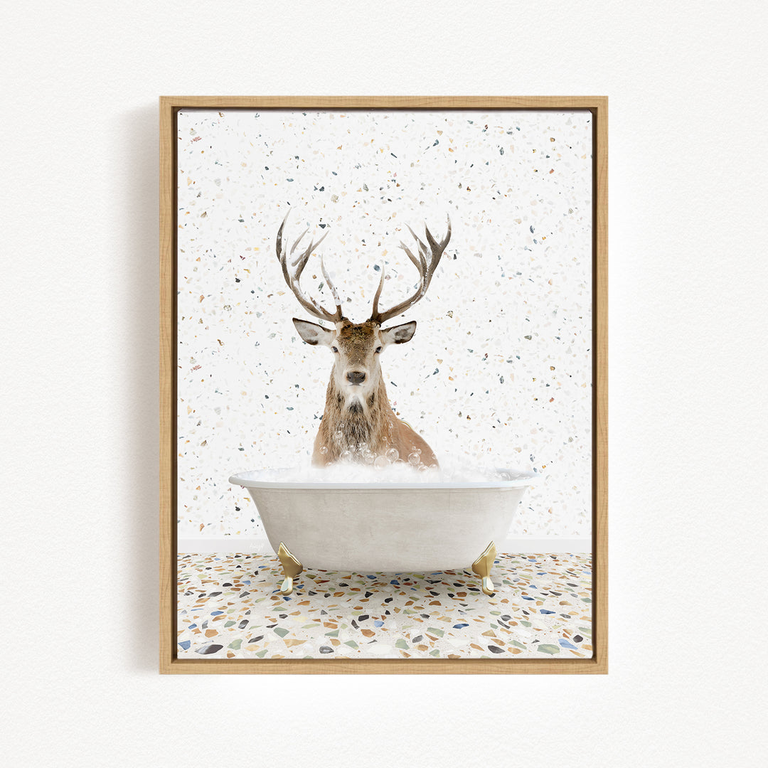 A deer with large antlers is sitting in a bathtub filled with water, surrounded by a speckled background.