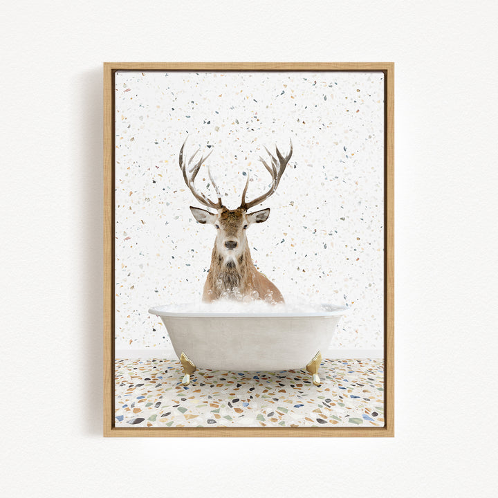 A deer with large antlers is sitting in a bathtub filled with water, surrounded by a speckled background.