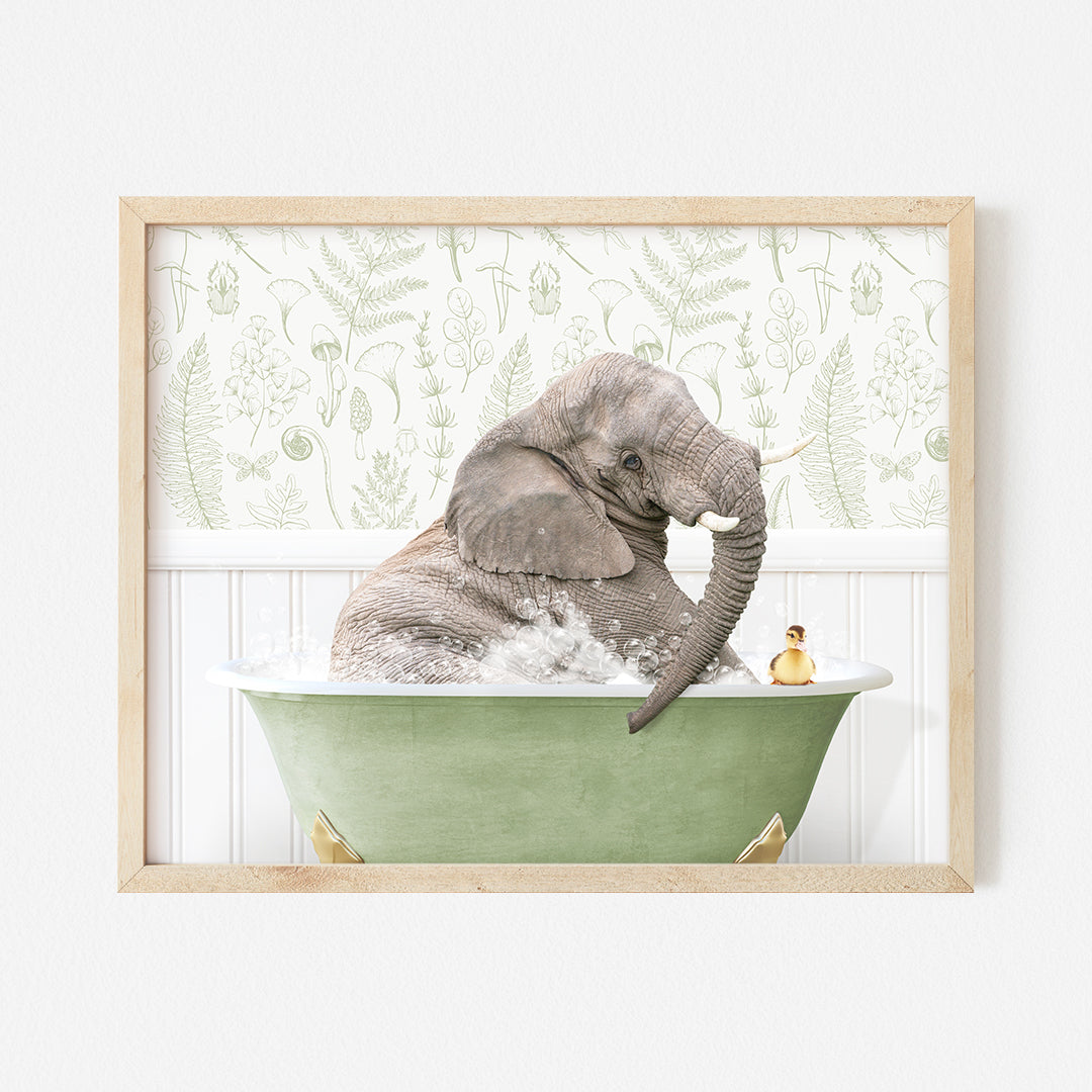 an elephant taking a bath in a green bathtub