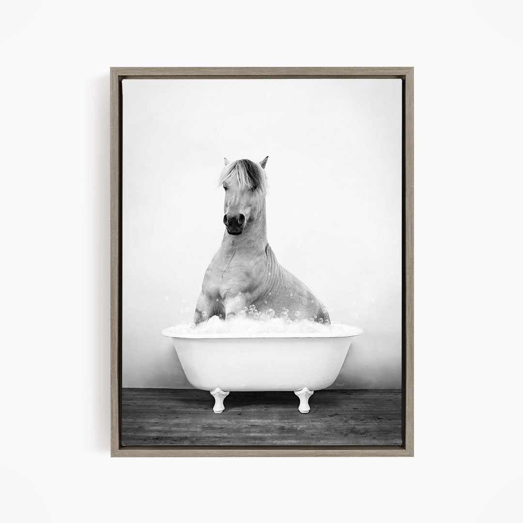 A horse sitting in a bathtub filled with water, creating a whimsical and playful scene.