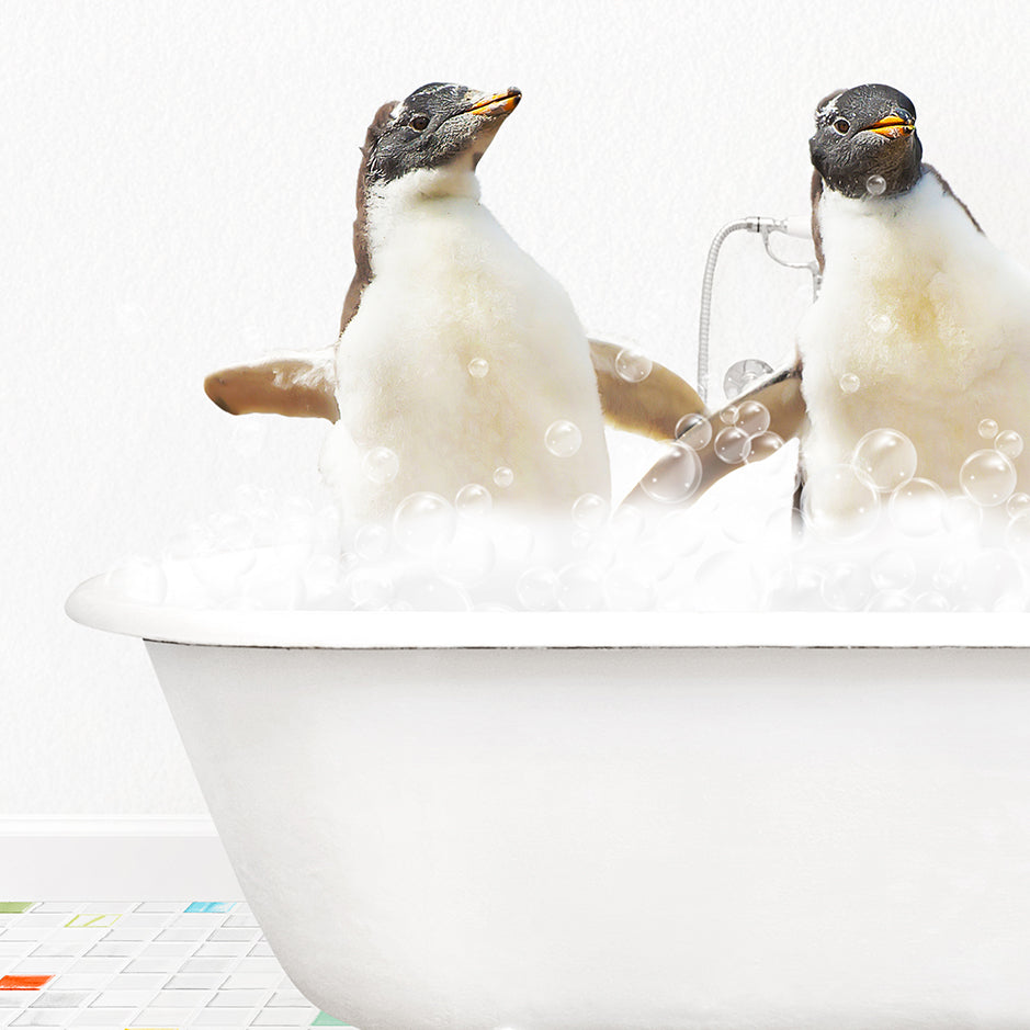 two penguins sitting in a bathtub with bubbles