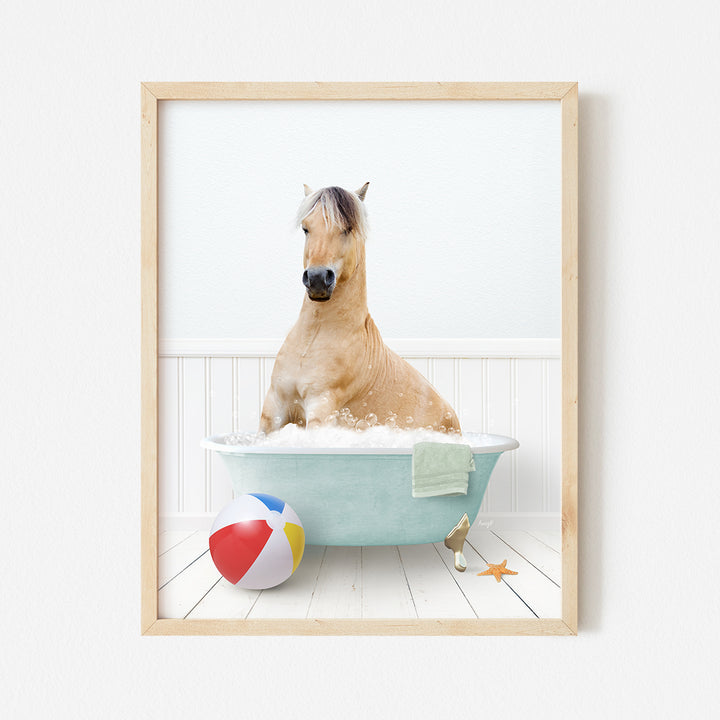 a horse in a bathtub with a beach ball