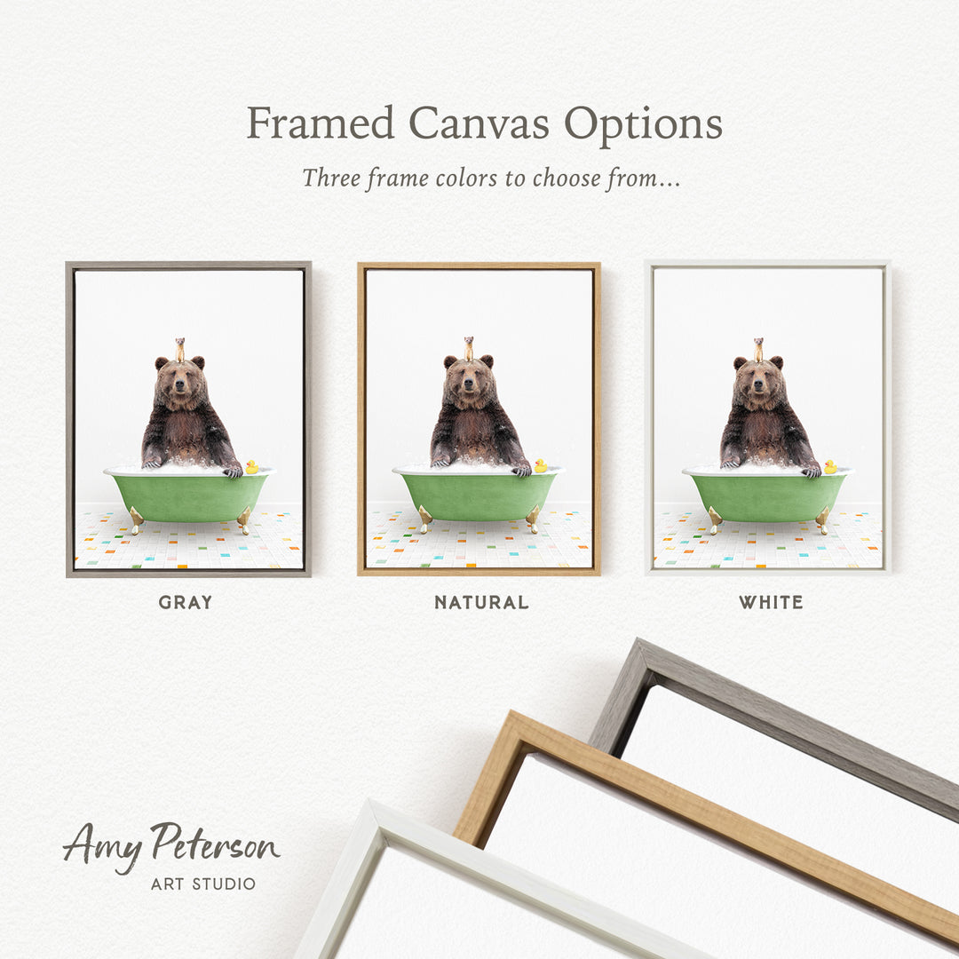 three framed canvas options featuring a bear sitting in a bathtub, each with a different frame color: gray, natural, and white.
