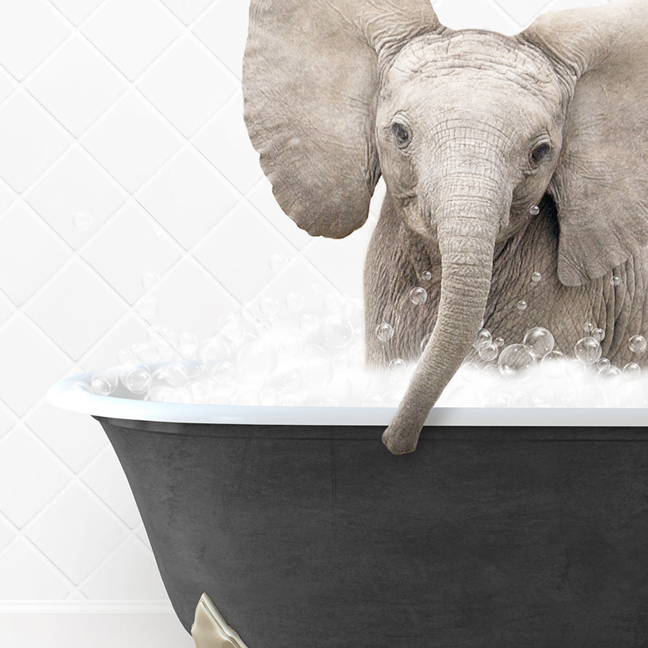 a baby elephant is taking a bath in a bathtub