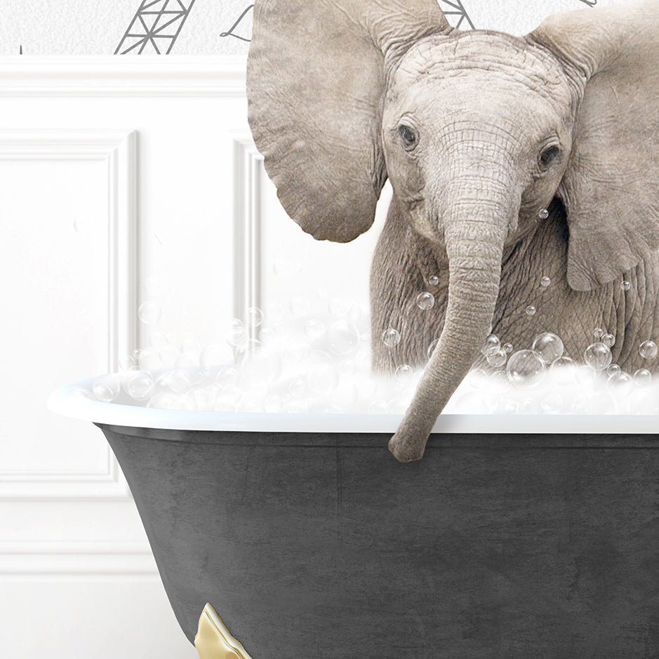 a baby elephant is taking a bath in a bathtub