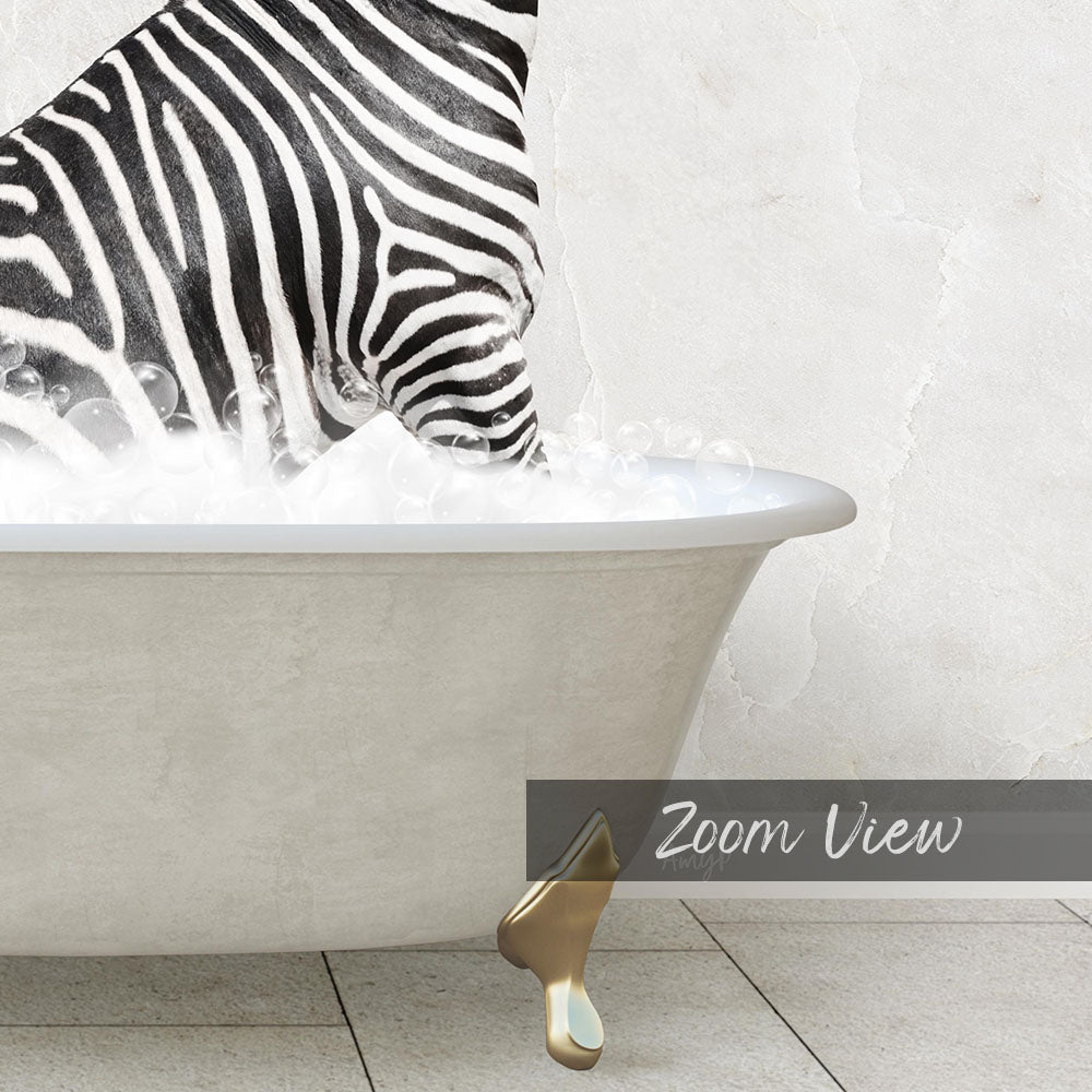 A zebra standing in a bathtub filled with bubbles, with a gold bathtub faucet visible.