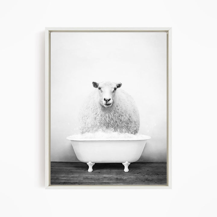 A fluffy white sheep is sitting in a white bathtub filled with bubbles, creating a whimsical and playful scene.