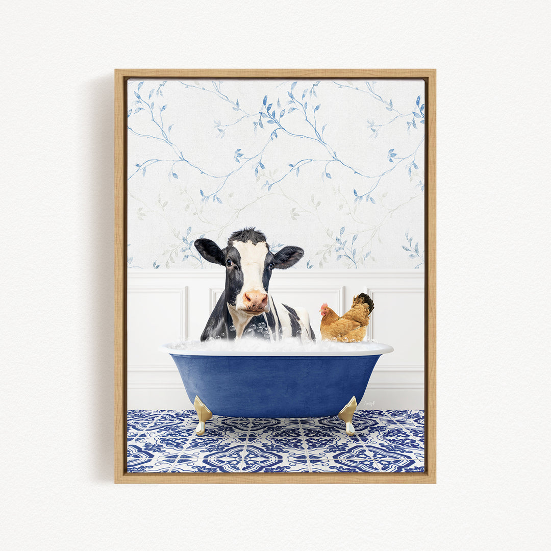 A black and white cow is sitting in a blue bathtub, with a chicken standing nearby, in a room with a blue and white floral patterned wall.
