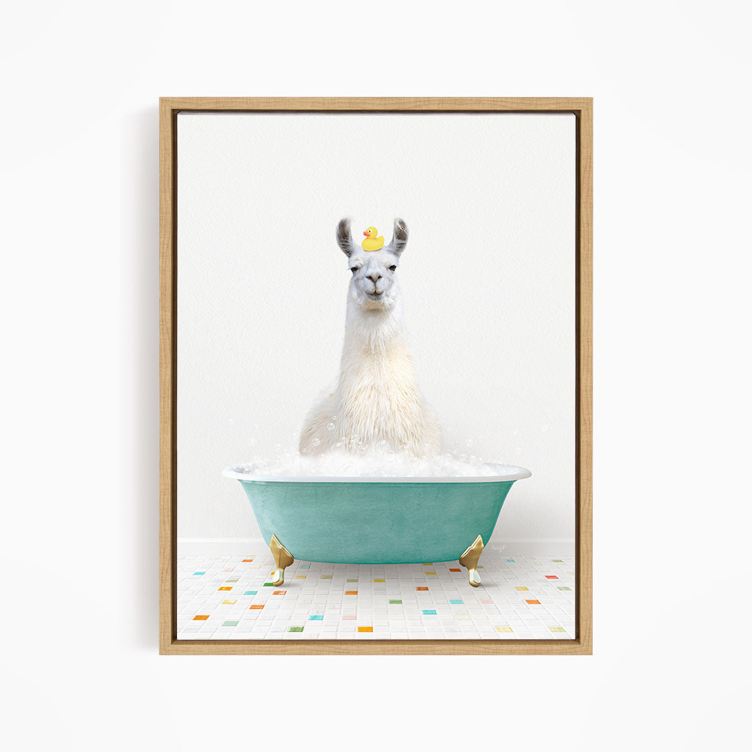 A white llama sitting in a green bathtub filled with bubbles, with a yellow rubber duck floating on its head.