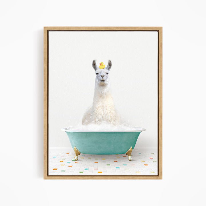 A white llama sitting in a green bathtub filled with bubbles, with a yellow rubber duck floating on its head.