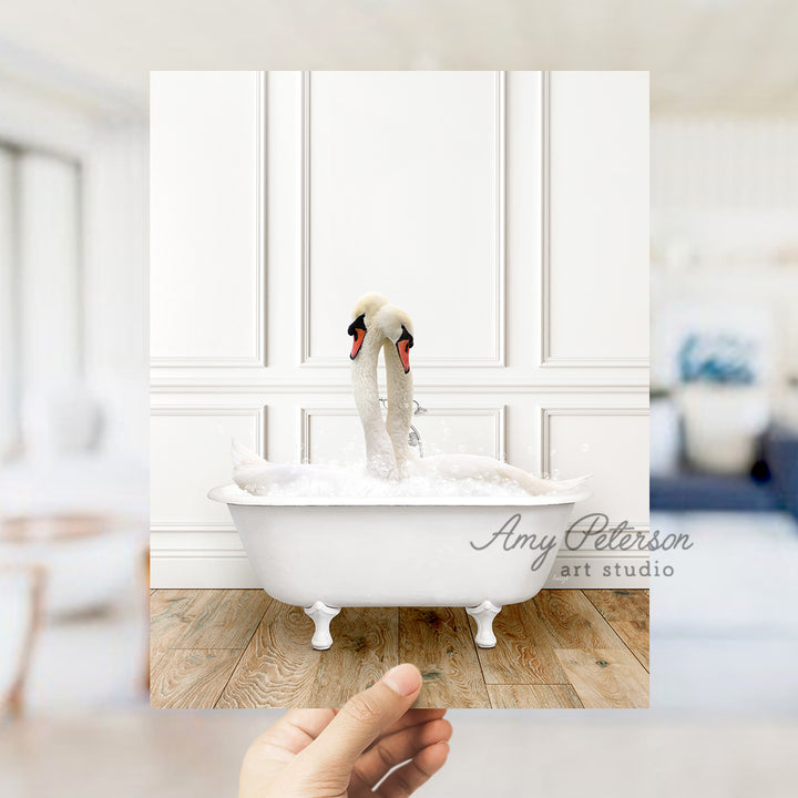 a person holding a photo of a swan in a bathtub