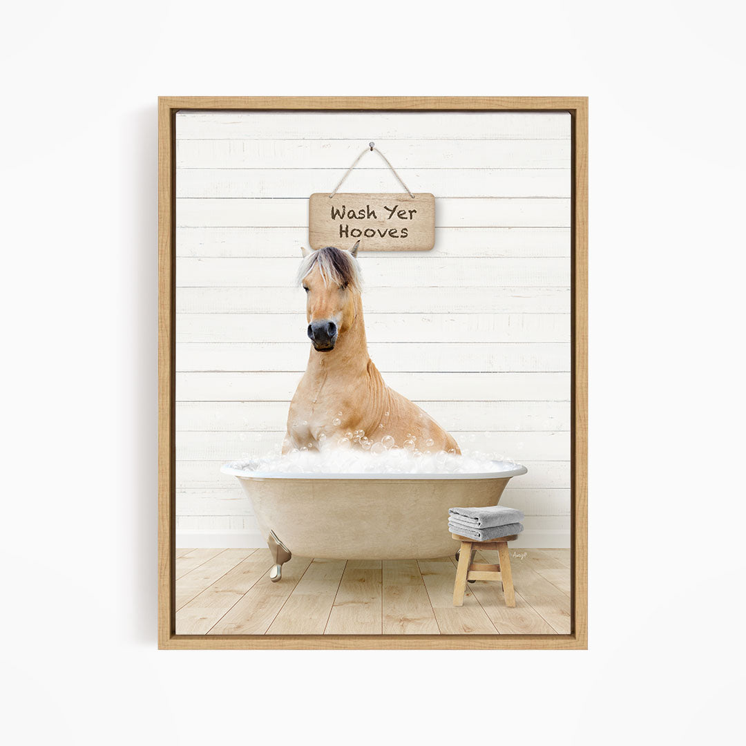 A light brown horse is sitting in a large bathtub filled with water, with a sign above it that says "Wash Yer Hooves".