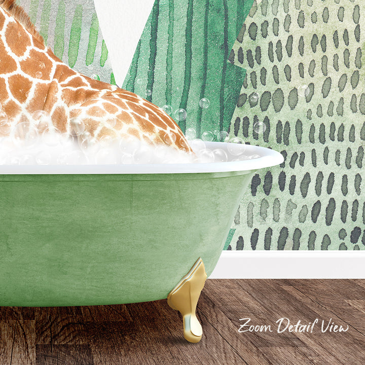 A giraffe is sitting in a green bathtub filled with bubbles, with a patterned wall in the background.